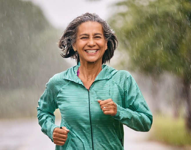 Women running in the rain