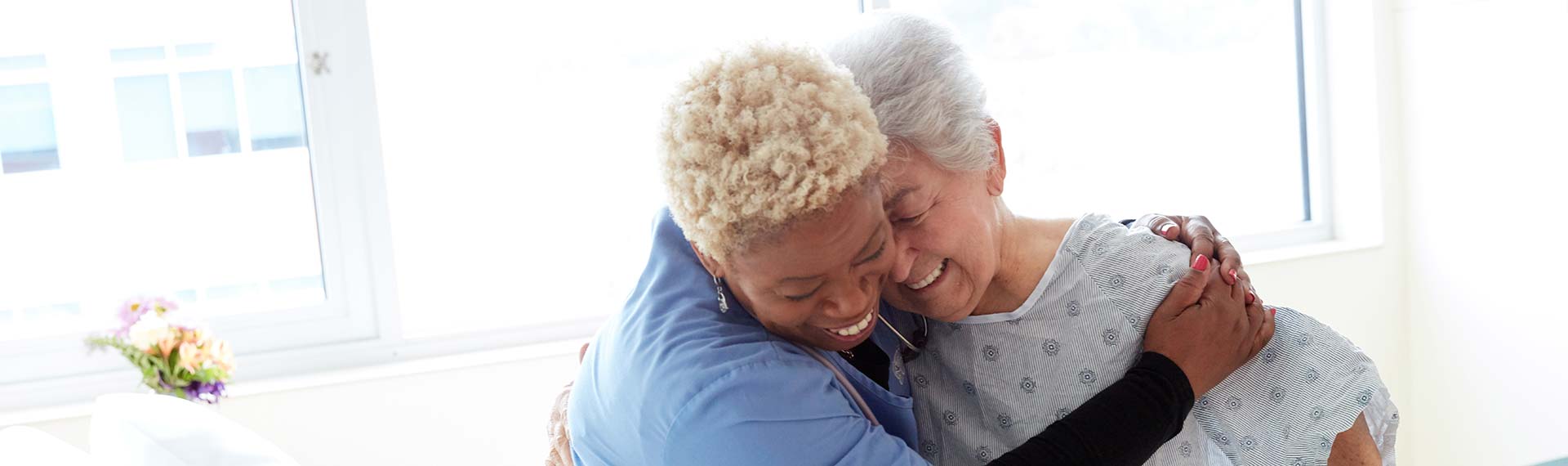 nurse hugging patient