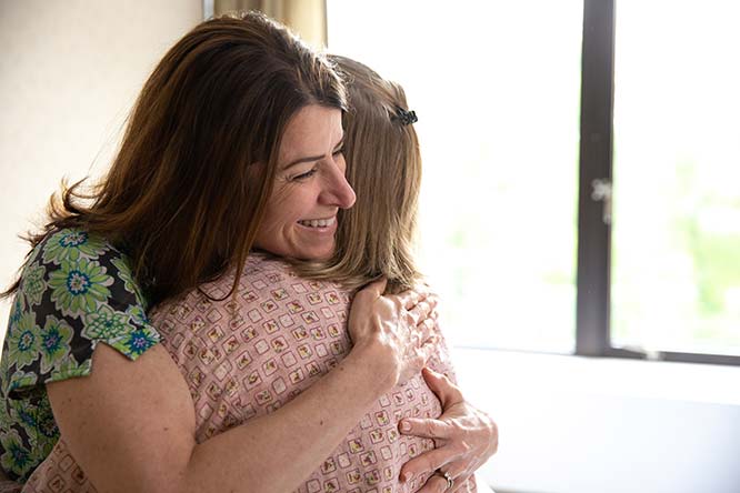 nurse hugging patient