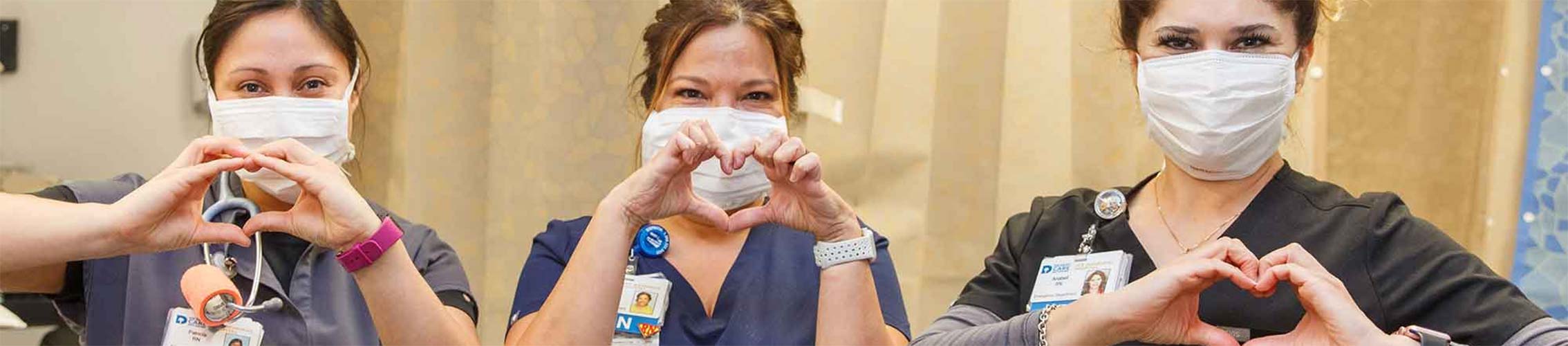 nurses with heart hands